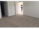 Carpeted bedroom with access to other rooms at 1963 Turtle Dove Ln, Kissimmee, FL 34746