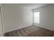 Bright bedroom with neutral carpeting and window at 1963 Turtle Dove Ln, Kissimmee, FL 34746
