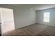 Bright bedroom featuring carpet and view into another room at 1963 Turtle Dove Ln, Kissimmee, FL 34746