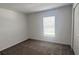 Simple bedroom with window, closet, and neutral carpeting at 1963 Turtle Dove Ln, Kissimmee, FL 34746