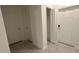Inviting entryway with closet and modern door hardware at 1963 Turtle Dove Ln, Kissimmee, FL 34746