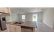 Kitchen with stainless steel appliances and an island at 1963 Turtle Dove Ln, Kissimmee, FL 34746
