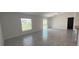 Bright living room with tile flooring and sliding glass doors at 1963 Turtle Dove Ln, Kissimmee, FL 34746