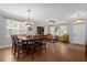 Dining room with a large wooden table, six chairs and hardwood floors at 30230 Tokara Ter, Mount Dora, FL 32757