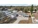 Aerial view of a house with a driveway and landscaped yard at 3743 Red Oak Ct, Lake Wales, FL 33898