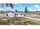 House exterior with landscaped yard and driveway at 3743 Red Oak Ct, Lake Wales, FL 33898