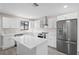 Updated kitchen featuring white cabinets, stainless steel appliances, and an island at 3743 Red Oak Ct, Lake Wales, FL 33898