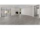 Bright living room featuring a fireplace and sliding glass doors at 3743 Red Oak Ct, Lake Wales, FL 33898