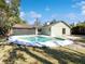 Home's backyard features a pool and a fenced-in area at 4026 Tenita Dr, Winter Park, FL 32792