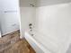 Bright bathroom with white bathtub and tile flooring at 4026 Tenita Dr, Winter Park, FL 32792