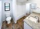Clean bathroom with a white bathtub, granite vanity, and brown tiled floors at 4026 Tenita Dr, Winter Park, FL 32792