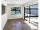 Dining room with pool view, tiled floor, and sliding glass doors at 4026 Tenita Dr, Winter Park, FL 32792