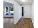 Bright entryway with tile flooring, white door, and views into the adjoining rooms at 4026 Tenita Dr, Winter Park, FL 32792
