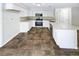 Modern kitchen with white shaker cabinets, granite countertops, and stainless steel appliances at 4026 Tenita Dr, Winter Park, FL 32792