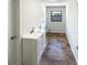 Laundry room with a single sink, white vanity, and tile flooring at 4026 Tenita Dr, Winter Park, FL 32792