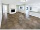 Living room with a stone fireplace and an open floor plan at 4026 Tenita Dr, Winter Park, FL 32792