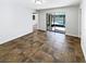 Living room with sliders opening to a view of the pool and tiled flooring at 4026 Tenita Dr, Winter Park, FL 32792
