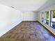 Spacious living room featuring tile flooring and large windows offering natural light at 4026 Tenita Dr, Winter Park, FL 32792