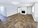 Living room with a stone fireplace and brown tiled floors at 4026 Tenita Dr, Winter Park, FL 32792