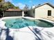 Inviting kidney-shaped pool with a large patio area at 4026 Tenita Dr, Winter Park, FL 32792