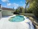 Inviting kidney-shaped pool with surrounding patio at 4026 Tenita Dr, Winter Park, FL 32792