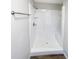 Clean shower with white tile surround and built-in seat at 4026 Tenita Dr, Winter Park, FL 32792
