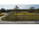 Dog park with fenced area, agility equipment, and shaded seating at 4815 Rigging St, Haines City, FL 33844