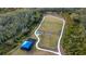 Fenced dog park with agility equipment and shaded seating at 4815 Rigging St, Haines City, FL 33844