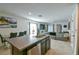 Open concept kitchen with island and stainless steel appliances at 4815 Rigging St, Haines City, FL 33844
