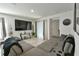 Spacious living area with sectional sofa, large TV, and view of kitchen at 4815 Rigging St, Haines City, FL 33844