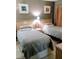 Bedroom with twin beds and neutral decor at 6165 Carrier Dr # 2103, Orlando, FL 32819