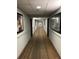 Clean and well-lit building hallway with modern decor at 6165 Carrier Dr # 2103, Orlando, FL 32819