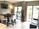 Bright dining area with table and chairs, leads to a patio at 6165 Carrier Dr # 2103, Orlando, FL 32819
