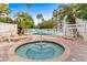 Relaxing resort-style pool and spa with lounge chairs at 6165 Carrier Dr # 2103, Orlando, FL 32819