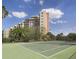 Tennis court with building in the background at 6165 Carrier Dr # 2103, Orlando, FL 32819