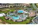 Aerial view of community pool, landscaping, and residential homes at 8979 Azalea Sands Ln, Davenport, FL 33896