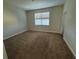 Bedroom with carpeted floor and window at 8979 Azalea Sands Ln, Davenport, FL 33896