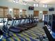 Modern fitness center with treadmills and weight machines at 8979 Azalea Sands Ln, Davenport, FL 33896