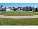 Large grassy area with a paved path, perfect for recreation at 8979 Azalea Sands Ln, Davenport, FL 33896