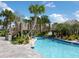Community lazy river pool with wooden bridge at 8979 Azalea Sands Ln, Davenport, FL 33896