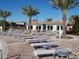 Plenty of lounge chairs around the pool for relaxation at 8979 Azalea Sands Ln, Davenport, FL 33896