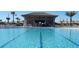 Inviting pool with a swim-up bar and lounge area at 8979 Azalea Sands Ln, Davenport, FL 33896