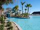 Relaxing pool with a waterslide and lush landscaping at 8979 Azalea Sands Ln, Davenport, FL 33896