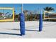 Beach volleyball court with nets and padded poles at 8979 Azalea Sands Ln, Davenport, FL 33896