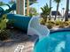 Fun waterslide leading into a refreshing pool at 8979 Azalea Sands Ln, Davenport, FL 33896