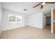 Bright living room with tile floors and ceiling fan at 1307 Kozart St, Orlando, FL 32811