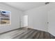 Spacious bedroom with vinyl plank flooring and a window at 16921 Sw 25Th Ct, Ocala, FL 34473