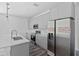 Modern kitchen featuring gray cabinets and stainless steel appliances at 16921 Sw 25Th Ct, Ocala, FL 34473