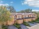 Aerial view of townhouses showcasing architectural details, landscaping, and community setting at 2020 Retreat View Cir, Sanford, FL 32771