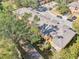 Aerial view of townhouses showing the back exterior, including landscaping and a paved pathway at 2020 Retreat View Cir, Sanford, FL 32771